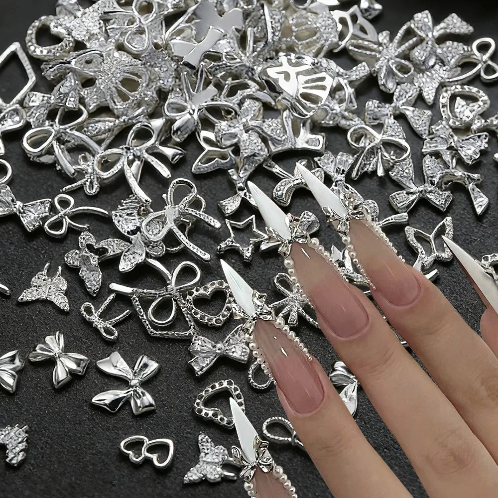 ชาร์มตกแต่งเล็บรูปโบว์ผีเสื้อโลหะผสมสีเงินสีทอง 50 ชิ้น สไตล์ Y2k น่ารัก รูปโบว์ผูกผม รูปหัวใจ ของตกแต่งเล็บโลหะ โบว์ผูกผมแบบผสม อุปกรณ์ทำเล็บ