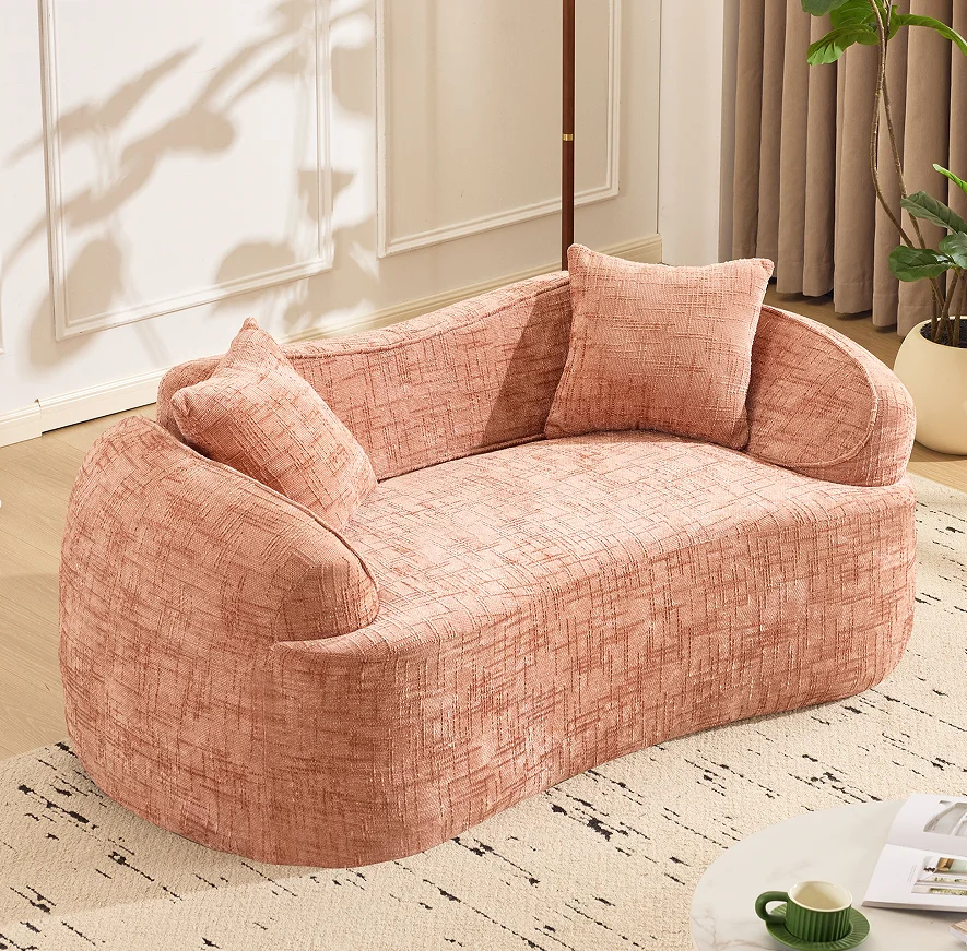 #Pink Curved Two - Person Compress Sofa. It Has Armrests On Both Sides, Comes With Two Pillows