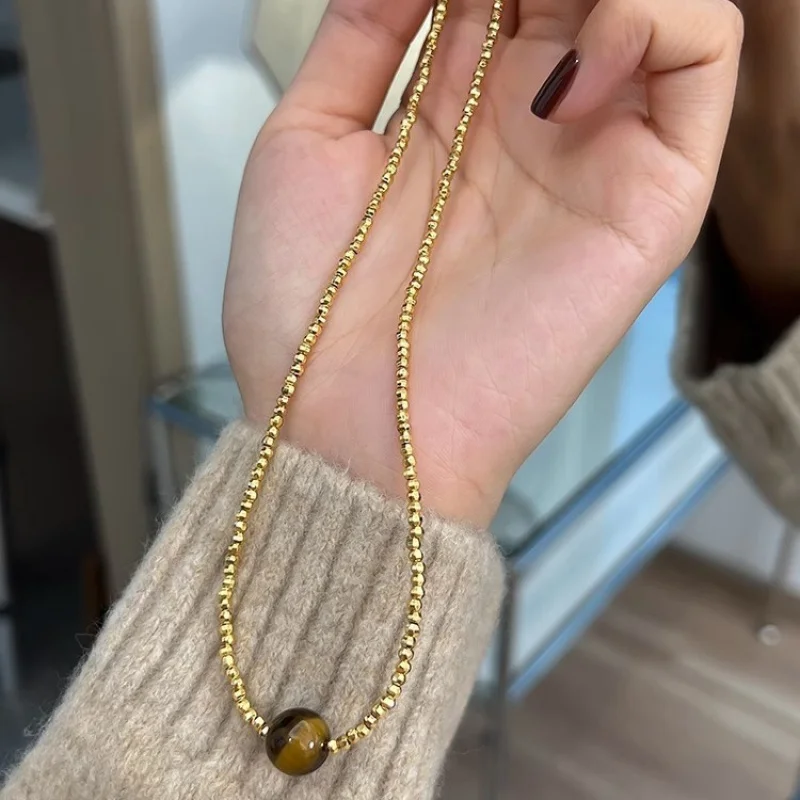 

Real Gold Electroplated Maillard Tigereye Gold Laser Bead Necklace Fashion Autumn and Winter Graceful Online Influencer Sweater