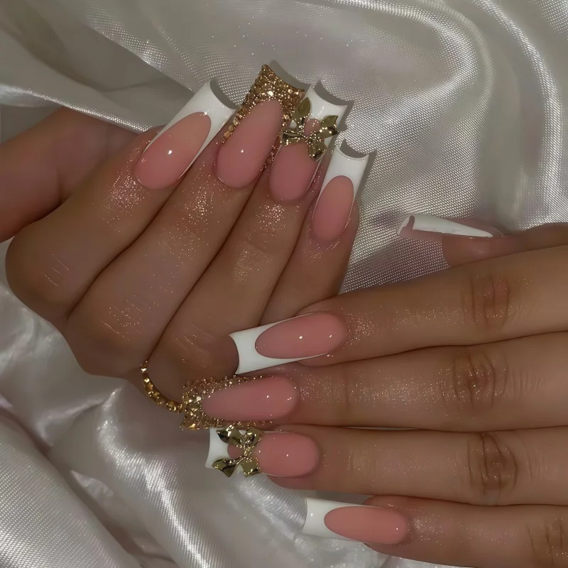 24PCS nail kit featuring a golden bow design suitable for wearing nail art. High end long nail art showcasing elegance.