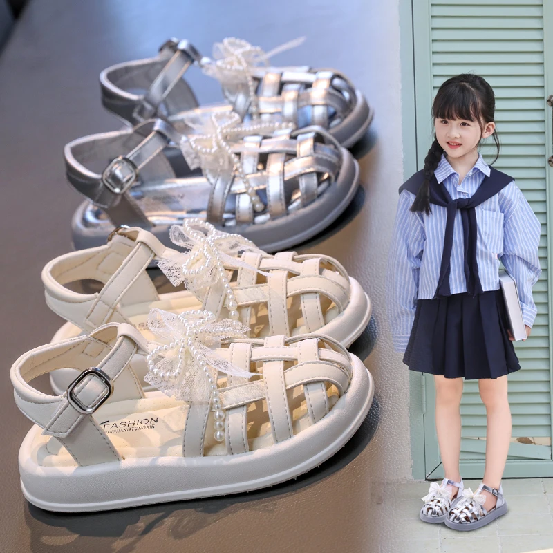 

Милые сандалии для девочек, тканые полые детские модные туфли принцессы с бантом, летние элегантные кружевные трендовые детские повседневные пляжные сандалии