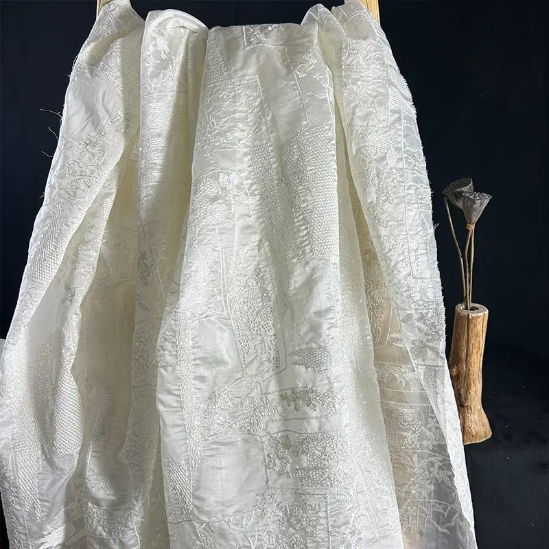 

Heavy-duty full embroidery fabric with three-dimensional relief embroidery suitable for wedding gowns and formal dresses