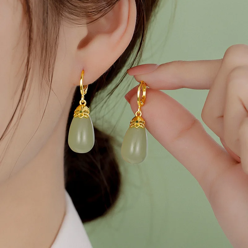 

Original natural Hetian jade fresh orchid earrings Chinese style retro unique ancient gold charm women's silver jewelry