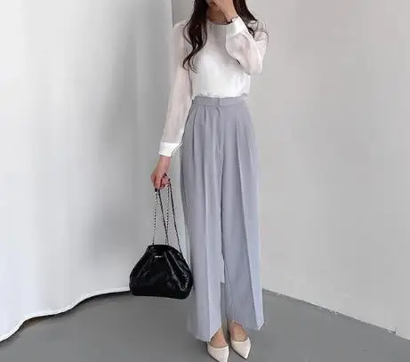 2026 Early Spring Fashion Simple Round Neck Mesh Slightly Transparent One Button Hollow Out Long Sleeved Bottom Shirt Top Women