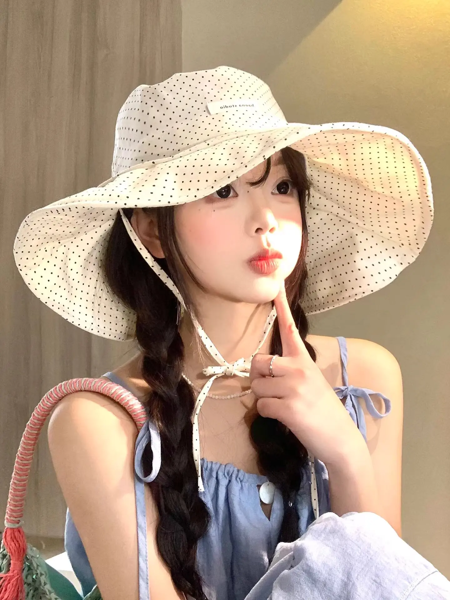 New polka dot strap bucket hat women's big brim sunscreen hat showing face small outdoor sun hat