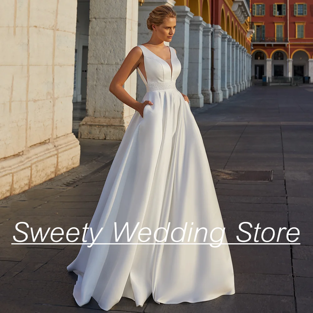 

Modern Wedding Dress V Neck Sleeveless Beading Sashes Backless Zipper Up A Line Satin Bridal Gown Pocket Woman Bride Dresses