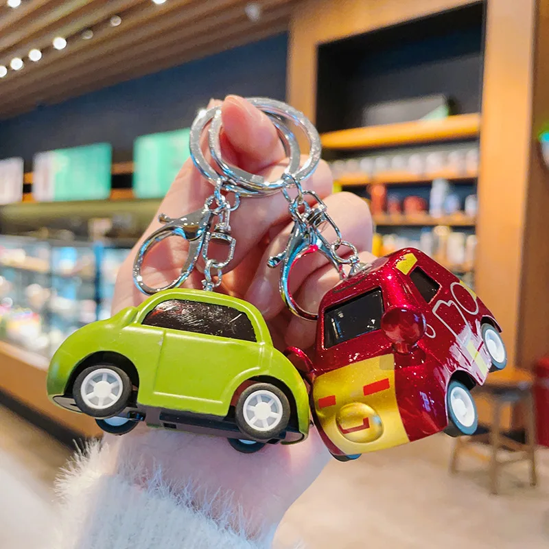 Cartoon alloy boomerang hero car keychain creative car model toy key chain bag hanging small gift