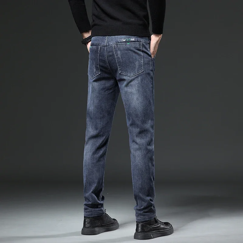 秋と冬の新作伸縮性のあるルーズフィットペンシルパンツファッションブランドデニムメンズジーンズカジュアルハーランパンツ