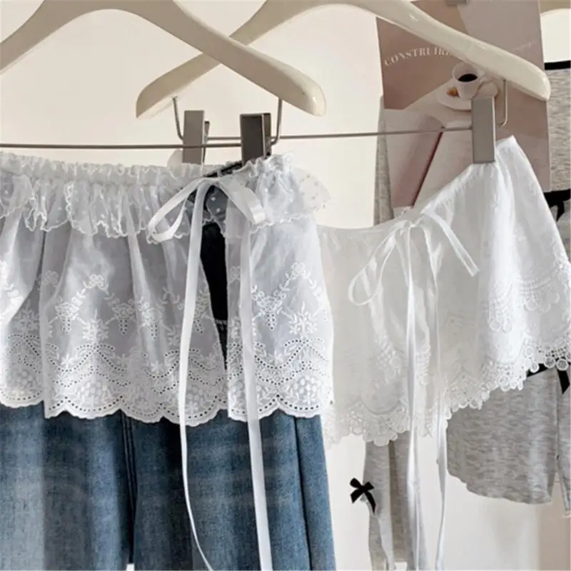 Frauen koreanische Stufe Rüschen Mini Schürze Rock Hollowout Blumenspitze Überdringung Hüftabdeckung Überträger Krawatte Taille