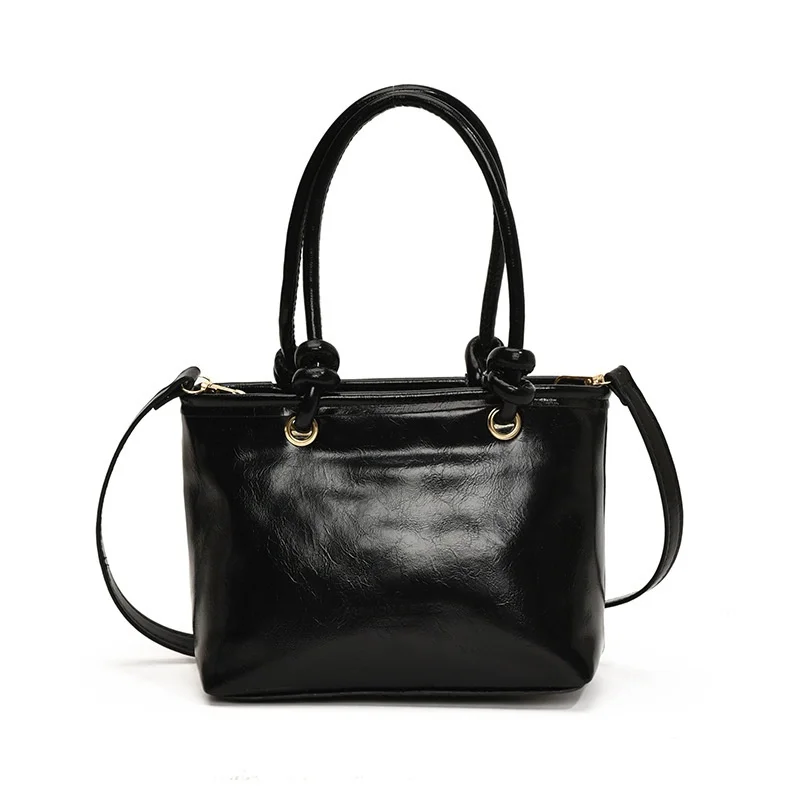 2025 nueva moda invierno versión coreana tendencia hermosa Color sólido Casual Simple bandolera bolso de cubo portátil mujeres