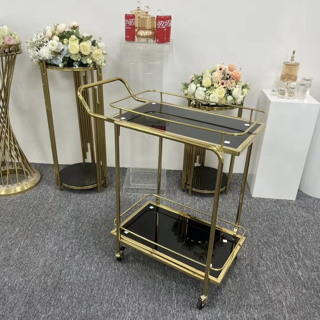 Elegant Gold Finish Metal Two Tier Serving Trolley With Glass Tray For Home Bar Kitchen Room Use With Durable And Sleek Look