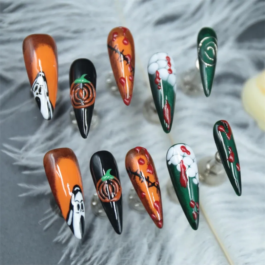 Handmade pressed fake nails, pumpkin Halloween elements, adhesive fake nails, long pointed styles, finished nail art,