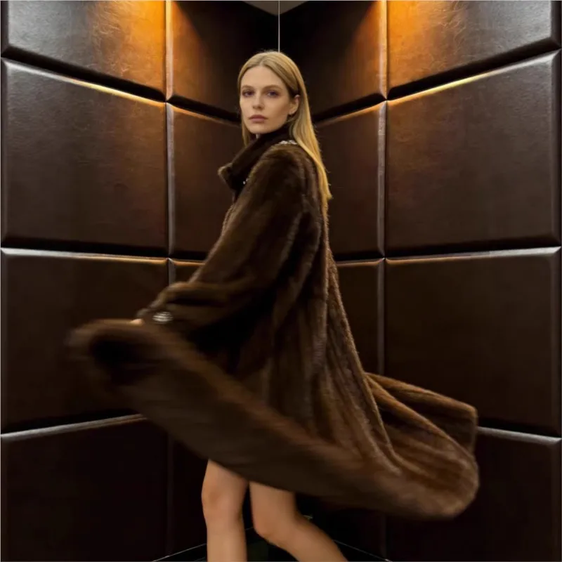 A long thick medium-textured warm three-dimensional fur coat for women