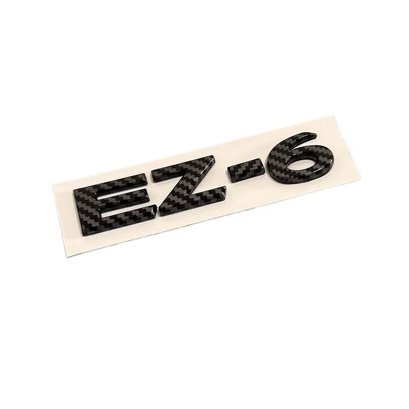 

For Mazda EZ-6 EV Modified Black Warrior luggage tail label carbon fiber texture car Emblems sticker