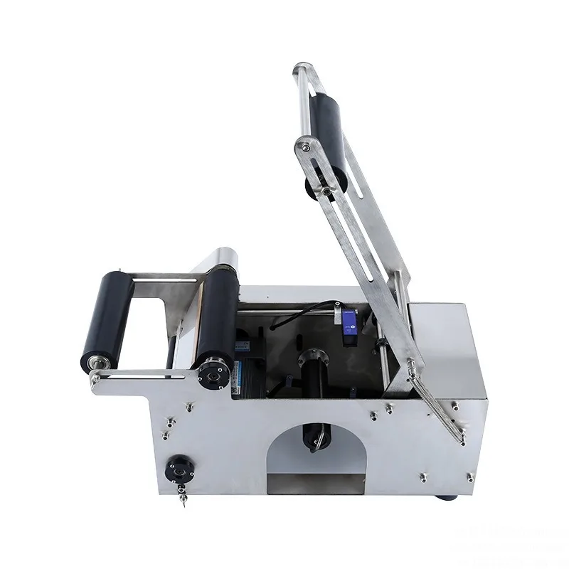 MT30 hand crank labeling machine, semi-automatic labeling machine, round bottle, manual feeding automatic labeling