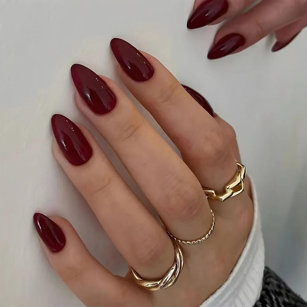 Full set of 24-piece almond fake nails - designed with glossy solid burgundy color, minimalist fashionable reusable press on fal