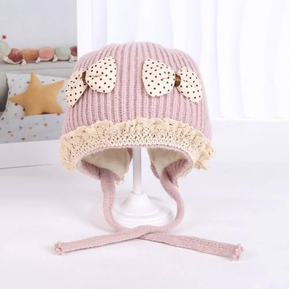 قبعة صوفية دافئة مقاومة للبرد والرياح لحماية الأذن قبعة Pompom محبوكة قبعة Lei Feng 3-36M