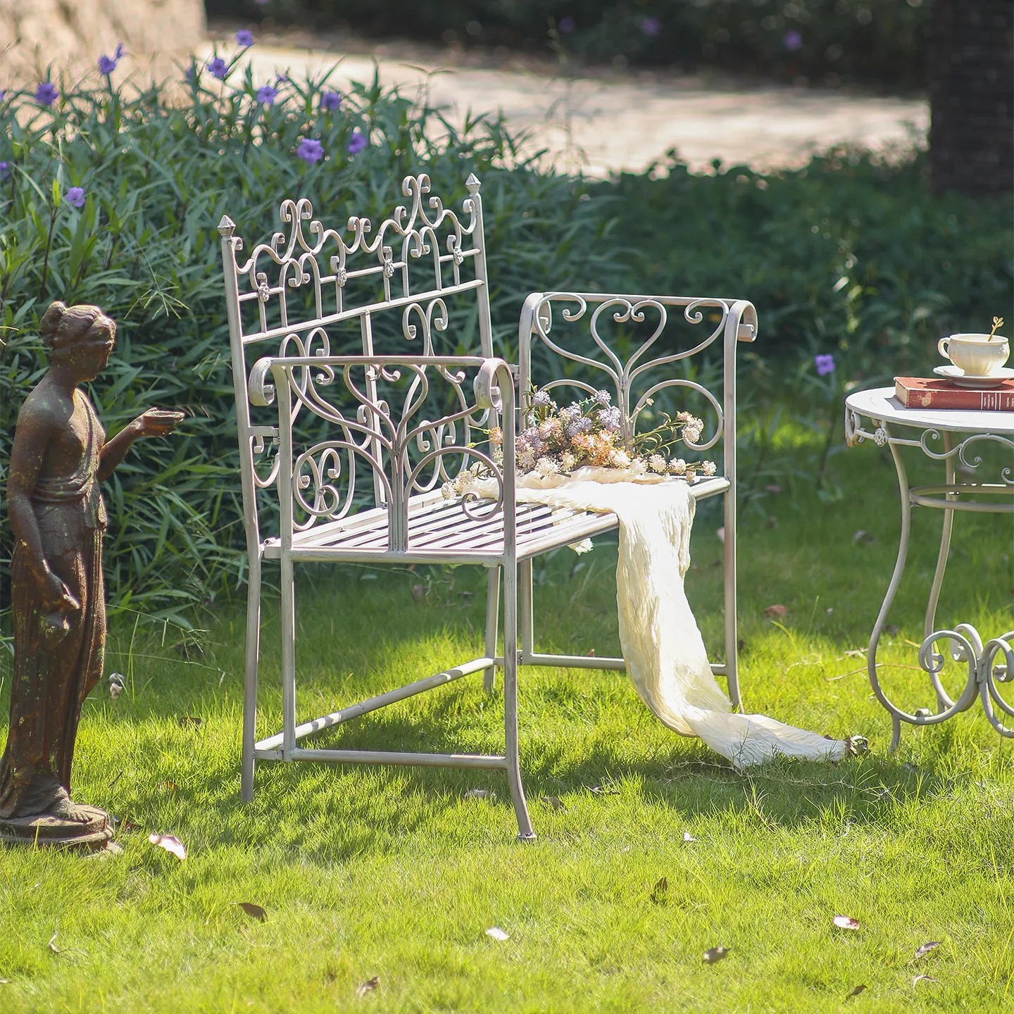 Retro and old white wrought iron edge few balcony small round table outdoor idyllic courtyard garden casual coffee table