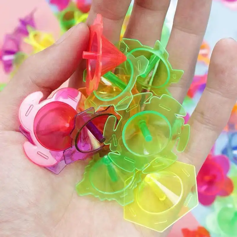 100pcs Mini colorato trasparente giroscopio fiore stella rotante giroscopio giocattoli bambini festa di compleanno bomboniere trattare regali per