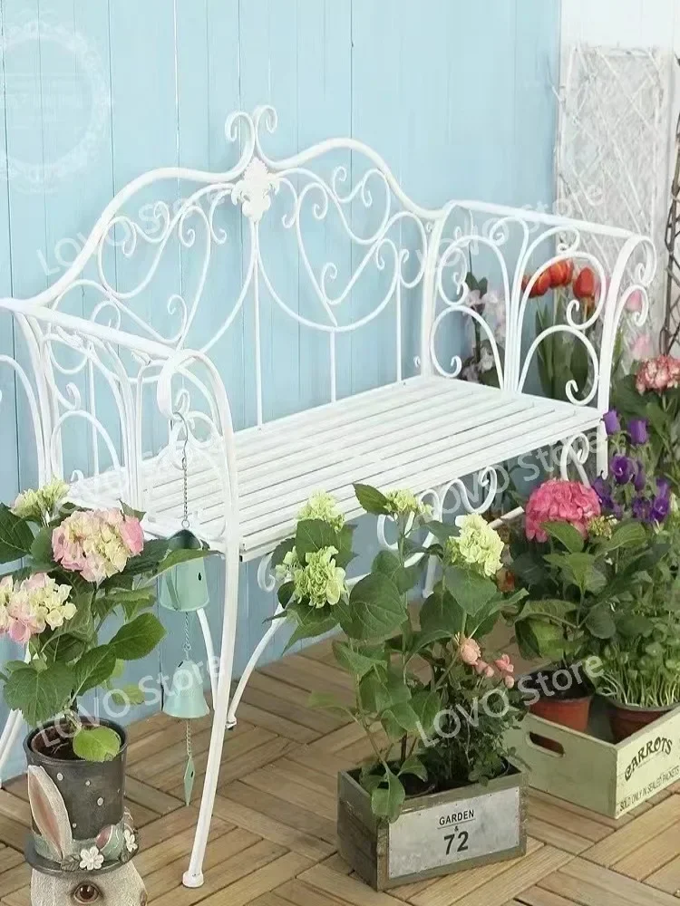 Outdoor garden bench  wrought iron table and chairs  balcony Courtyard