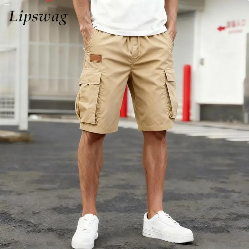 

Модные мужские шорты-карго с несколькими карманами, летние повседневные свободные прямые брюки, винтажные мужские однотонные шорты на шнуровке
