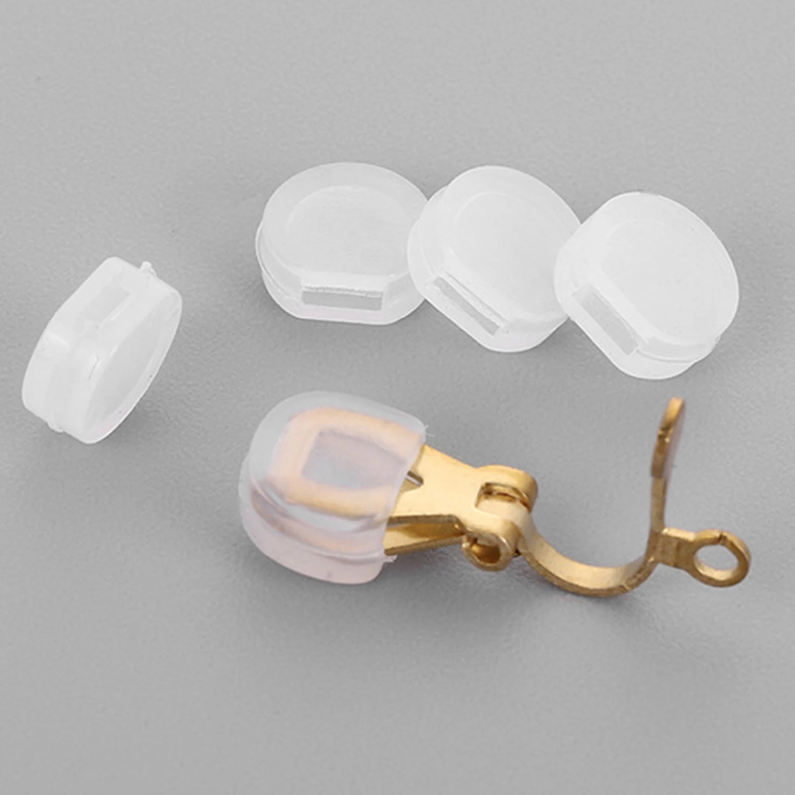 

100pcs Ear Clip Pads Silicone Cushion Backs for Earrings DIY Soft Clear Anti Pain Handmade Craft Sewing Supplies