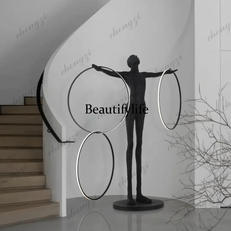 Humanoid art statues fall to the ground, the living room is light luxury and modern, and the exhibition hall is decorated with