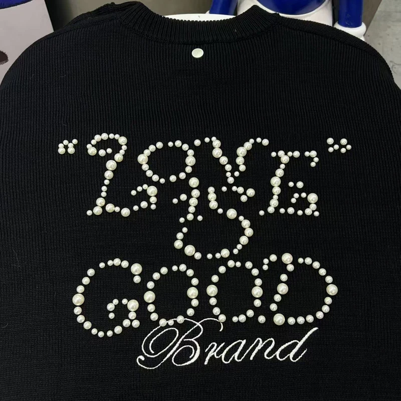 Nuevo estilo coreano buen Top Pearl Knight suéter de punto abotonado de un solo hombro cuello redondo Goodbrand pulóver suelto Casual Stock