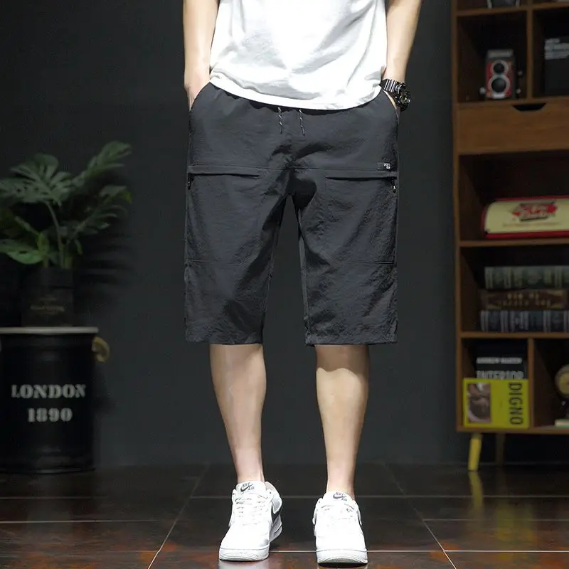 Summer New Fashion Casual Versatile Loose Beach Shorts Men Elastic Waist Drawstring Pockets Big Size Sports Straight Short Pants