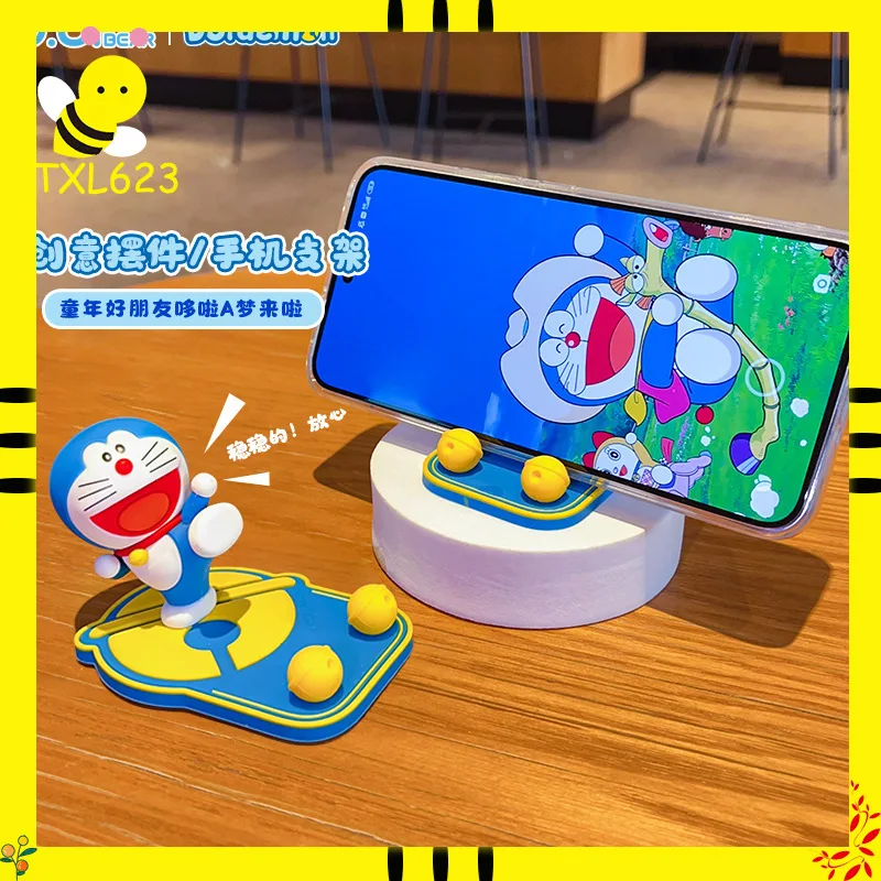Soporte para teléfono Doraemon, soporte de escritorio con dibujos animados, soporte móvil Universal para coche, oficina, decoración del hogar, adorno, juguete creativo, regalo