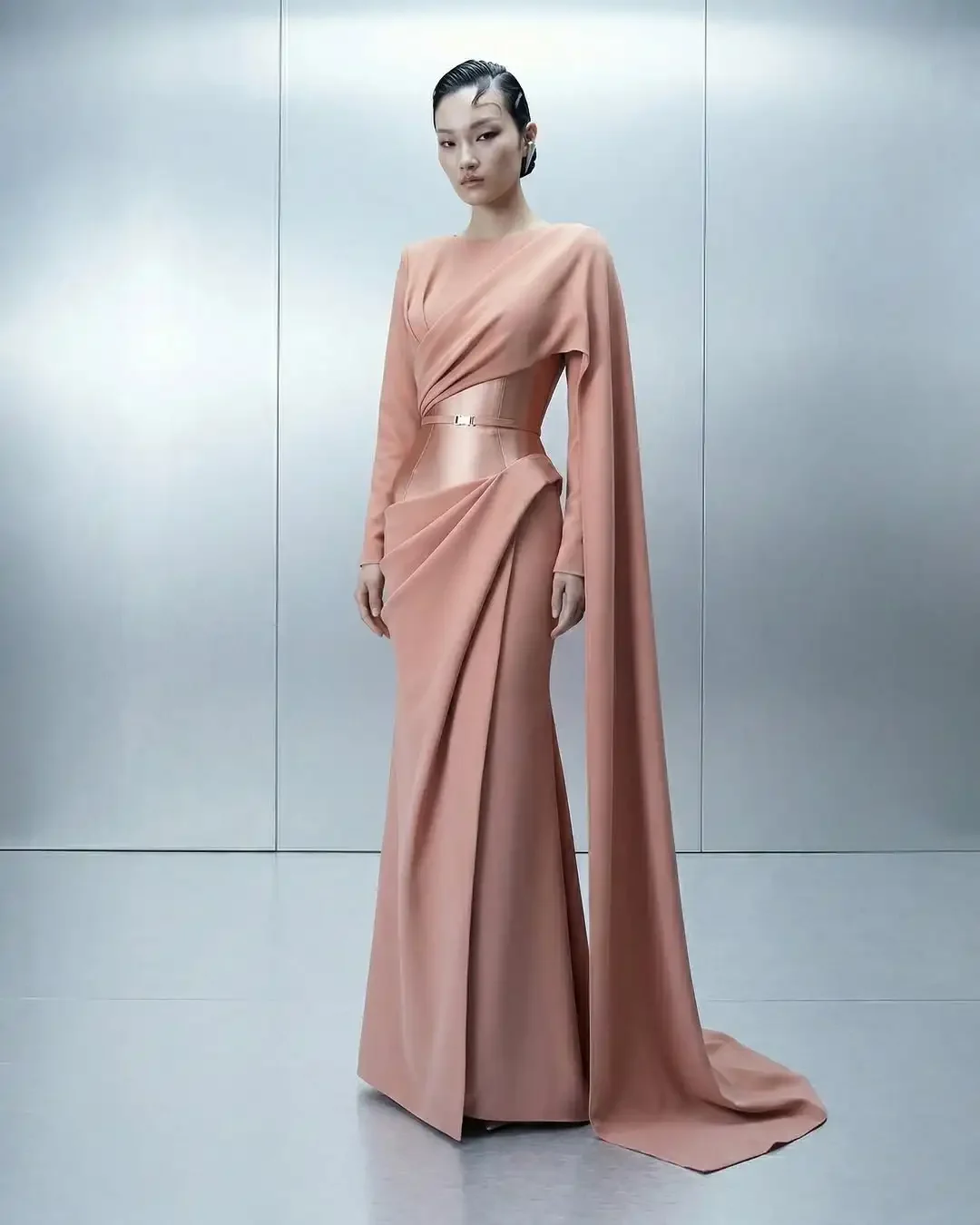 Elegant Blush Pink Satin Gown with Draped Cape Sleeves, Belted Waist & Flowy Floor-Length Silhouette – Lili's Couture Collection