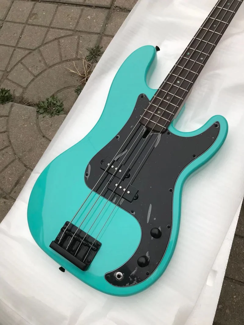 

2022 brand new high quality 4 string P bass guitar The flame maple neck Real photos free delivery