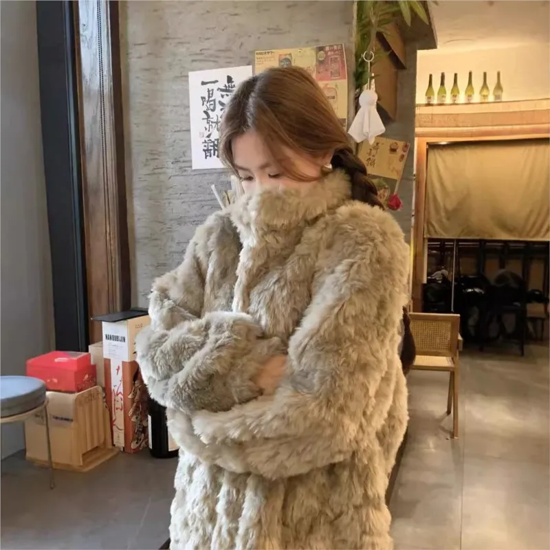 A stand-up collar fur coat for women's fashion mid-length loose and casual with mix of