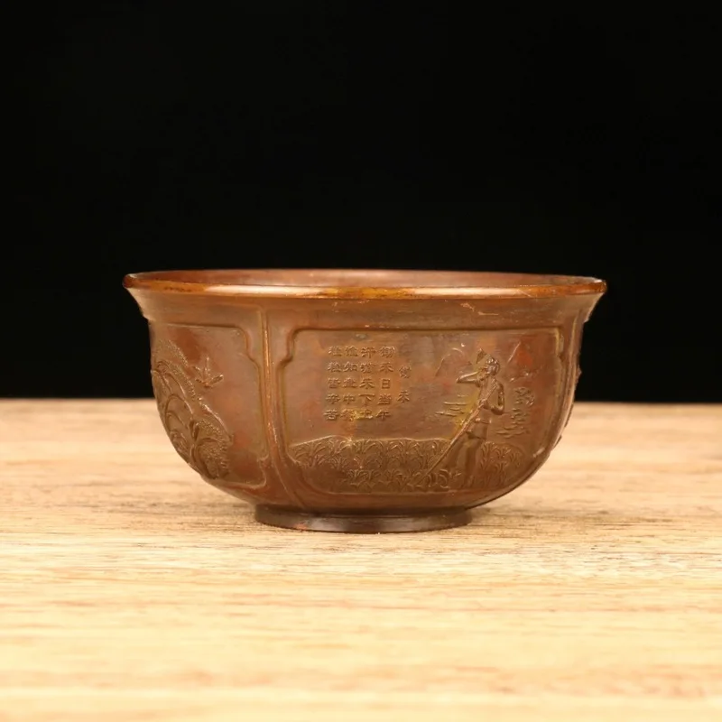 Antique-style harvest bowl with aged patina and relief carving, featuring the 