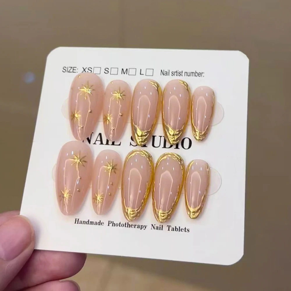 

10 шт./набор, накладные ногти ручной работы среднего размера, в форме миндаля, с 3D-гелем, золотистым френч-дизайном, 3D-гелевыми золотыми звездами и блестками.