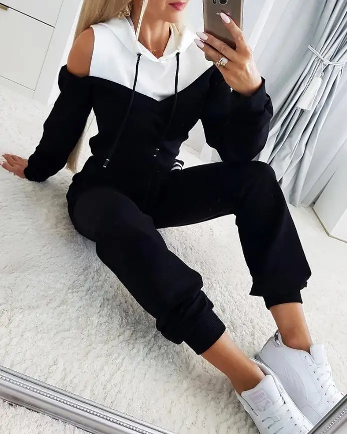 

2-piece color blocked cold shoulder long sleeved drawstring hoodie top and contrasting striped elastic waist pants set