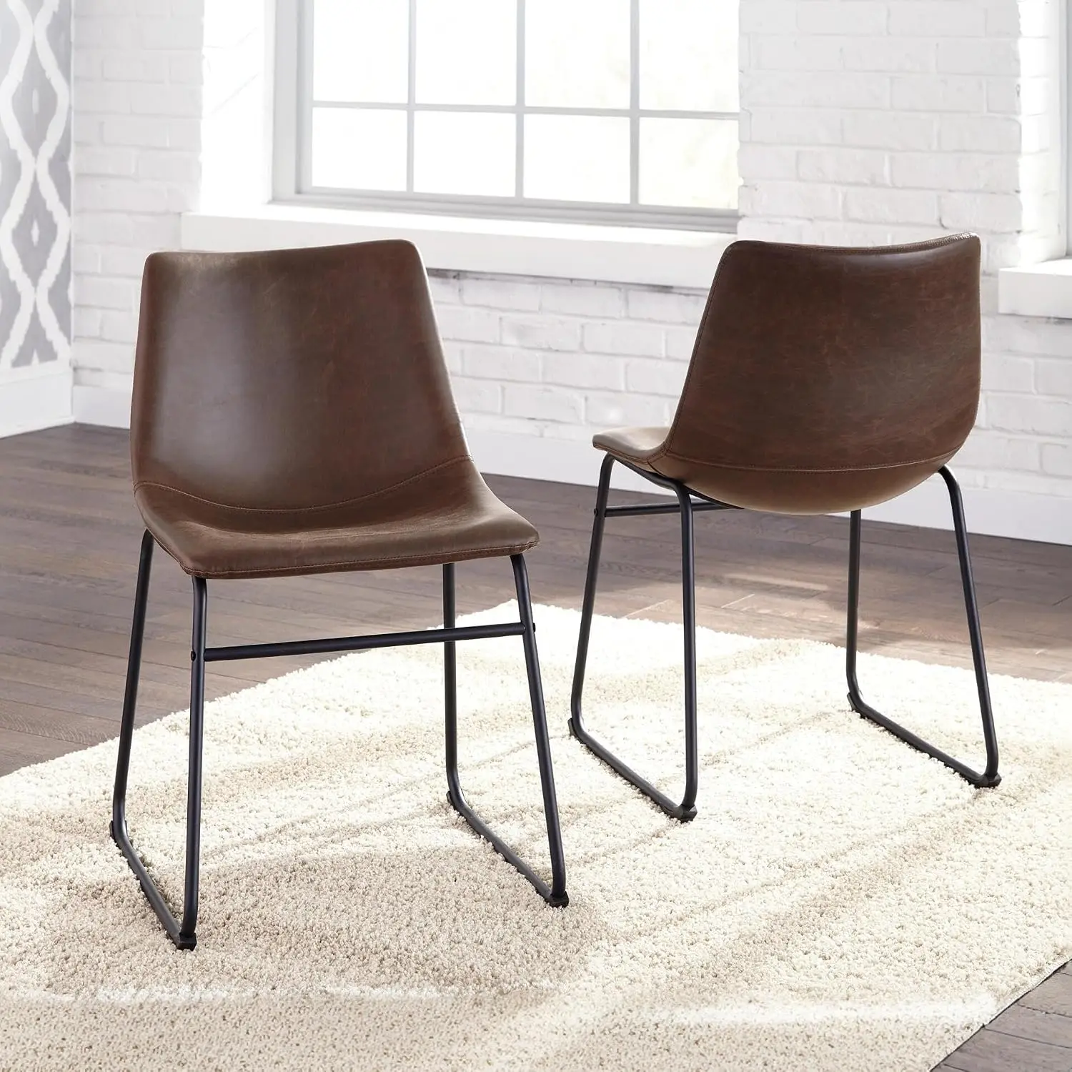 Mid-Century Dining Chair Set of 2, Brown | Contoured faux leather bucket seats, Matte black tubular metal base, Optimized for compact kitchen and eat-in spaces