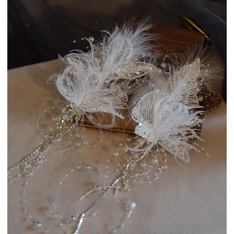 Bridal headdress feather white lace super fairy princess beautiful fashion temperament elegant tassel clip wedding accessories.