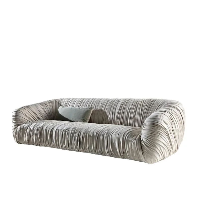 

Light luxury designer living room leather art sofa simple creative small apartment special-shaped pleated three-person sofa