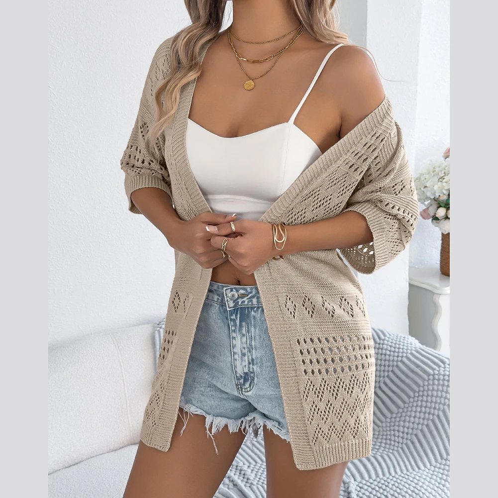 

Knitted women's cardigan sweater with mid sleeves and cutout accents in a solid color designed for casual occasions