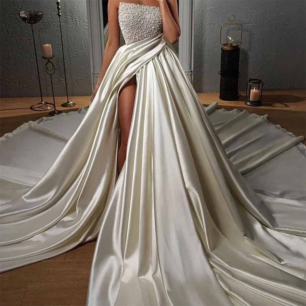 Vestidos de novia elegantes sin tirantes con cuentas, sin mangas, plisados, corte en A, personalizados