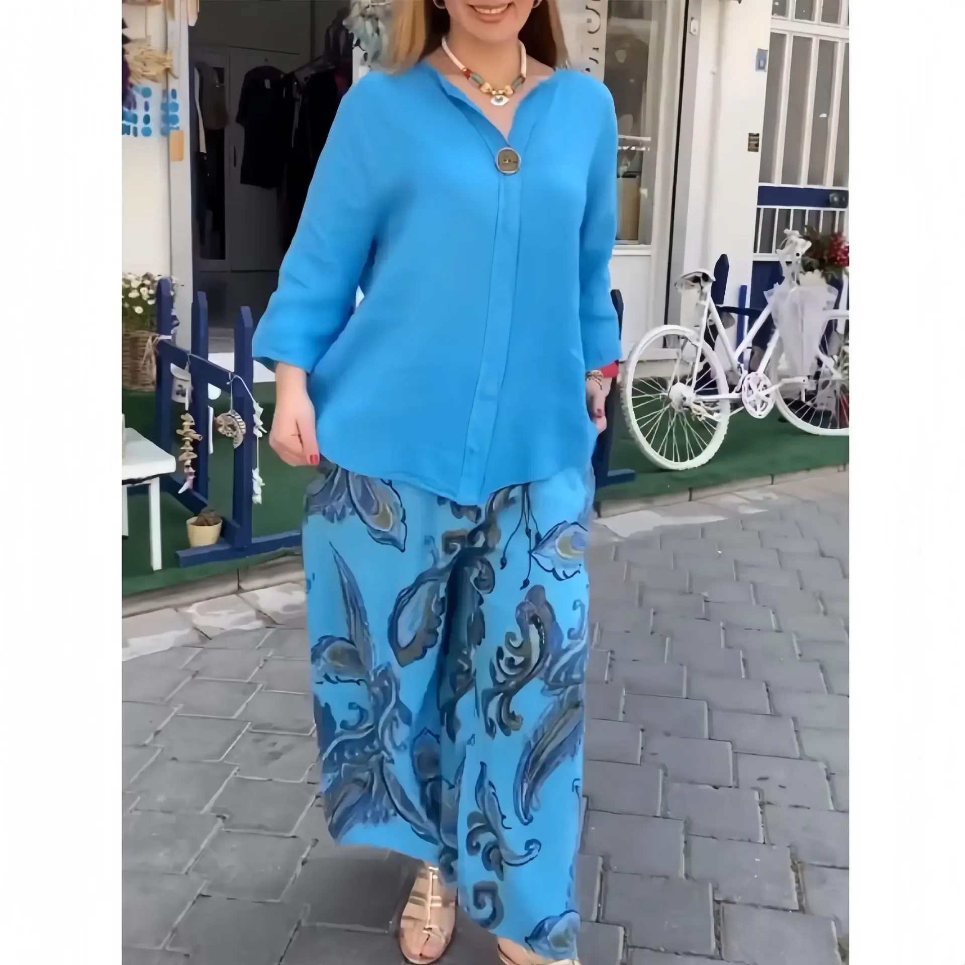 Set di pantaloni da donna in due pezzi Set di pantaloni larghi Casual a maniche lunghe top elegante stampa giuntura pantaloni lunghi a gamba larga elastico in vita autunno