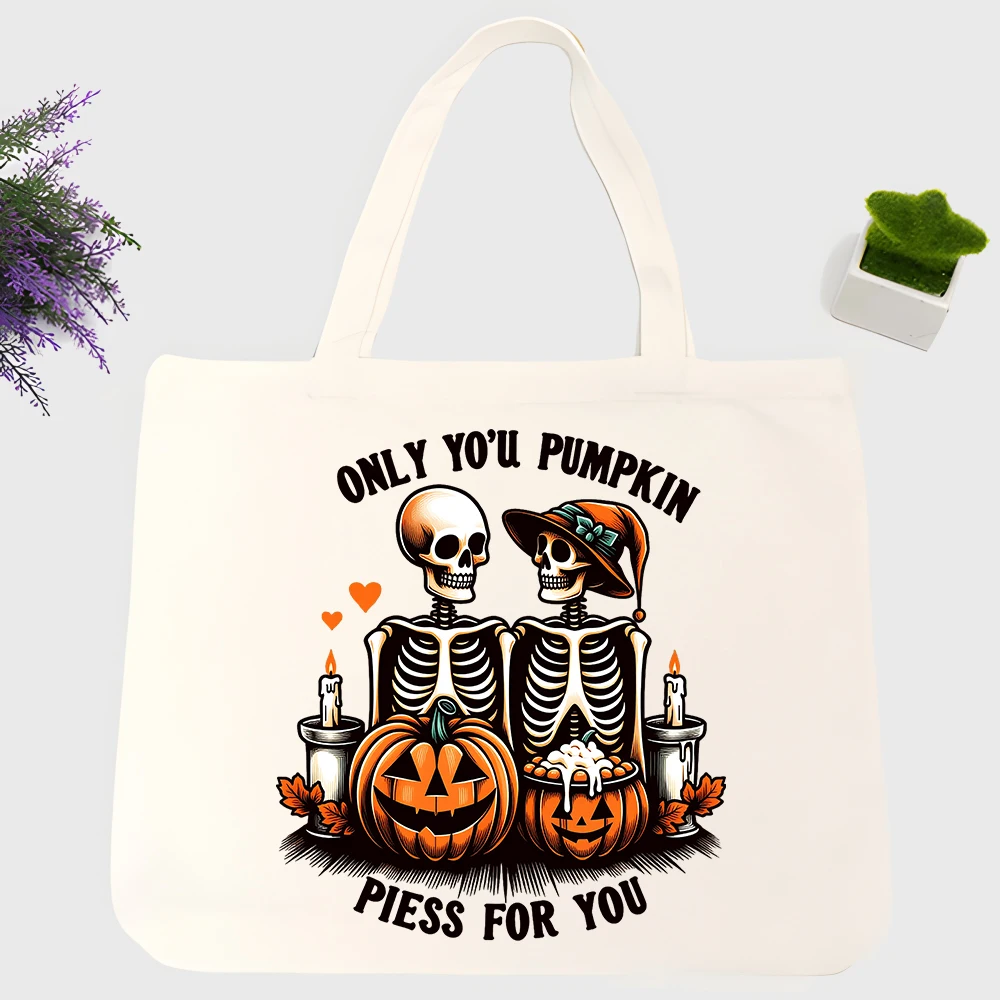 Men's skull and pumpkin graphic canvas tote bag, vintage Halloween style for casual shopping and seasonal outings