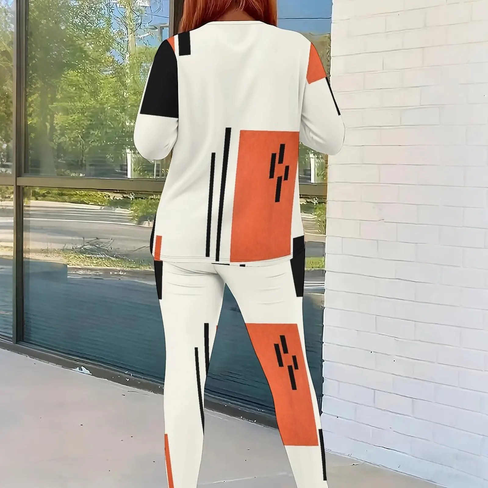 Women Geometric Black Orange White Color Block Printed Round Neck Long Sleeve Top and Fitted Pants Two Piece Set