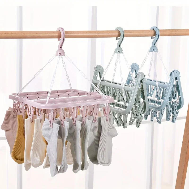 Plastic hanger with 32 clips, designed specifically for hanging clothes, underwear, socks, and daily household items