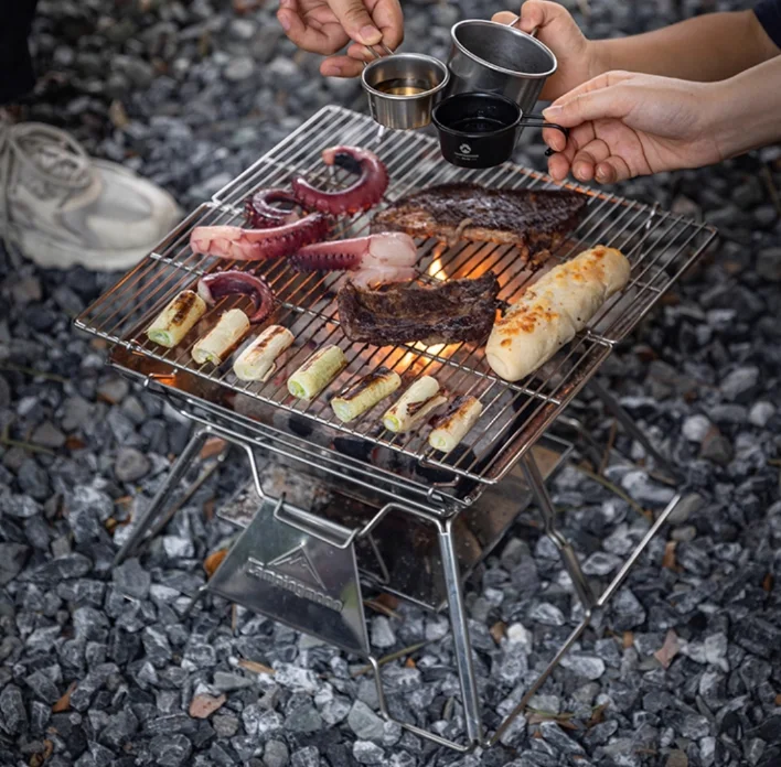 

Portable Stainless Steel Folding Camping BBQ Grill Fire Pit with Charcoal for Outdoor Lightweight Meat Roasting and Firewood Bur