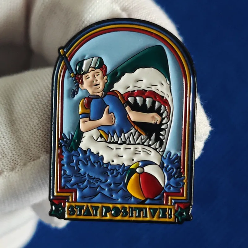Stay Positive. Brooch Shark Eats a Young Guy. Fun Metal Badge. Fashionable Lapel Pin Accessory