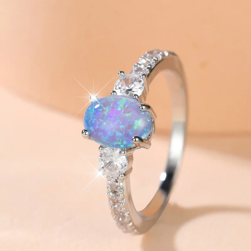 2026 New Four Claw Blue Synthetic Auspicious Treasure Ring with Dense Zircon on The Side, Simple and Versatile Jewelry