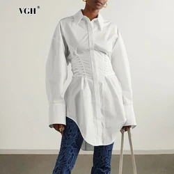 VGH Solid Spliced Bandage Slimming Blouses for Women Lapel Long Sleeve Patchwork Single Breasted Irregular Hem Shirts Female New