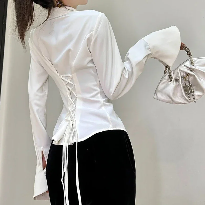 2024 early autumn trumpet long sleeved polo collar white shirt with a unique design for women, featuring a back strap top